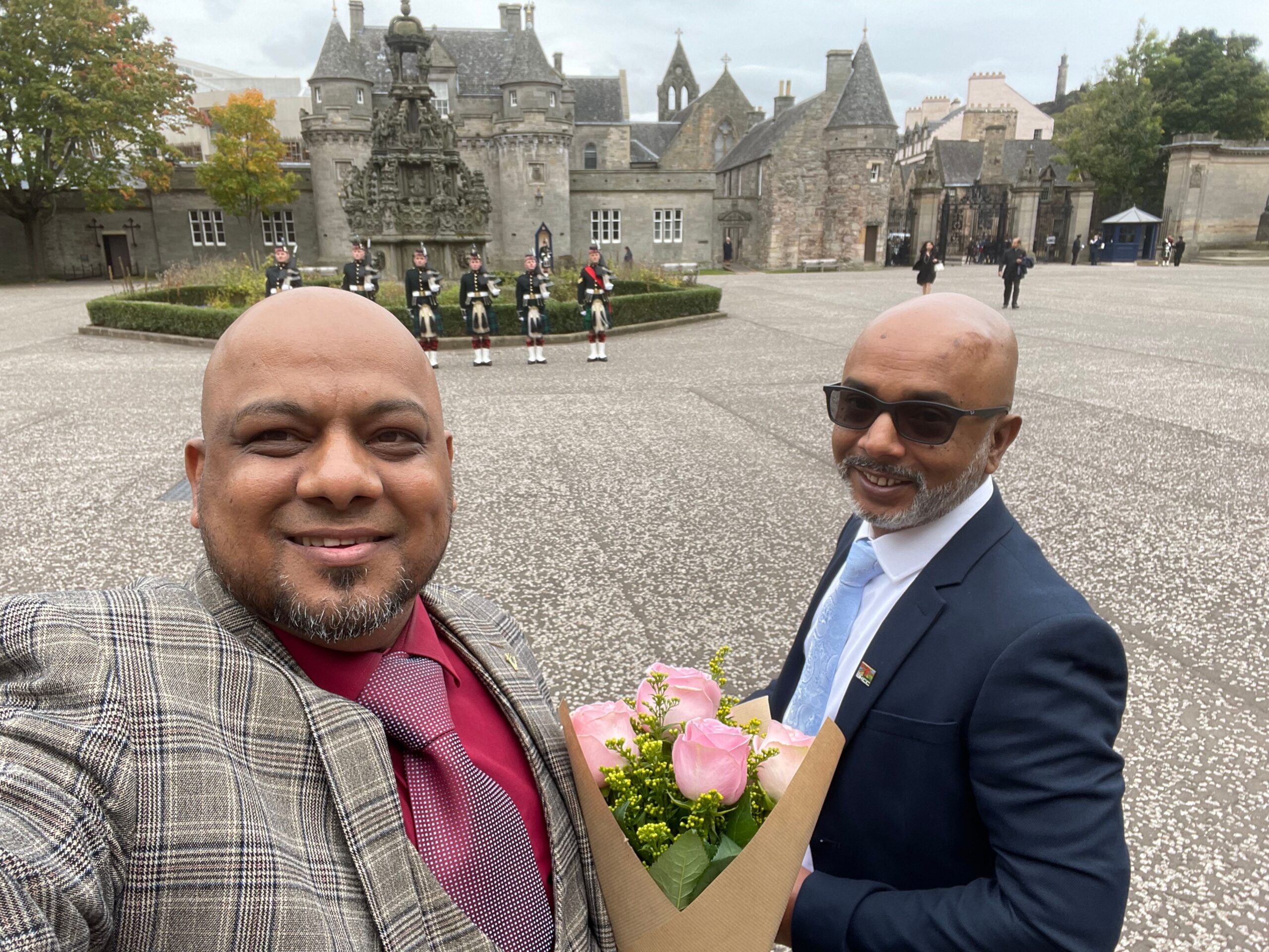 Naseem Talukdar and Moslek Uddin at the Palace of Holyroodhouse to visit King Charles III for their campaign work.