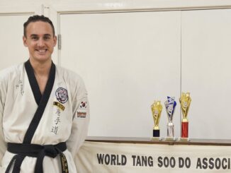 Mitch Hopes with his trophies for Tang Soo Do.