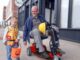 an older man and a young boy on a scooter