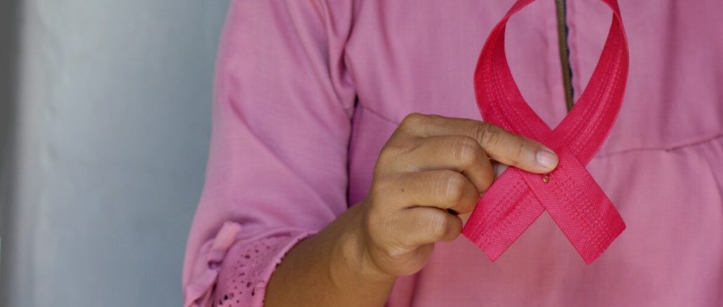 woman in pink and white polka dot shirt