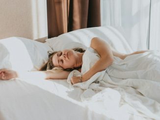 a person lying in a bed